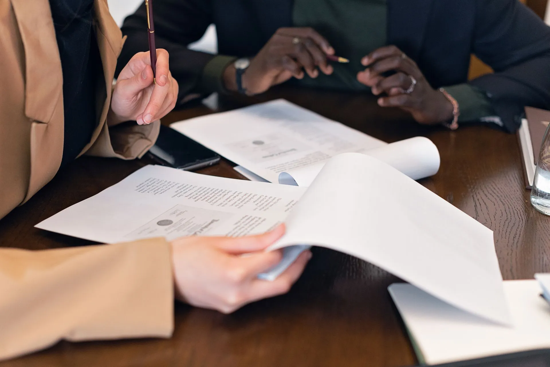Professionals reviewing land documents