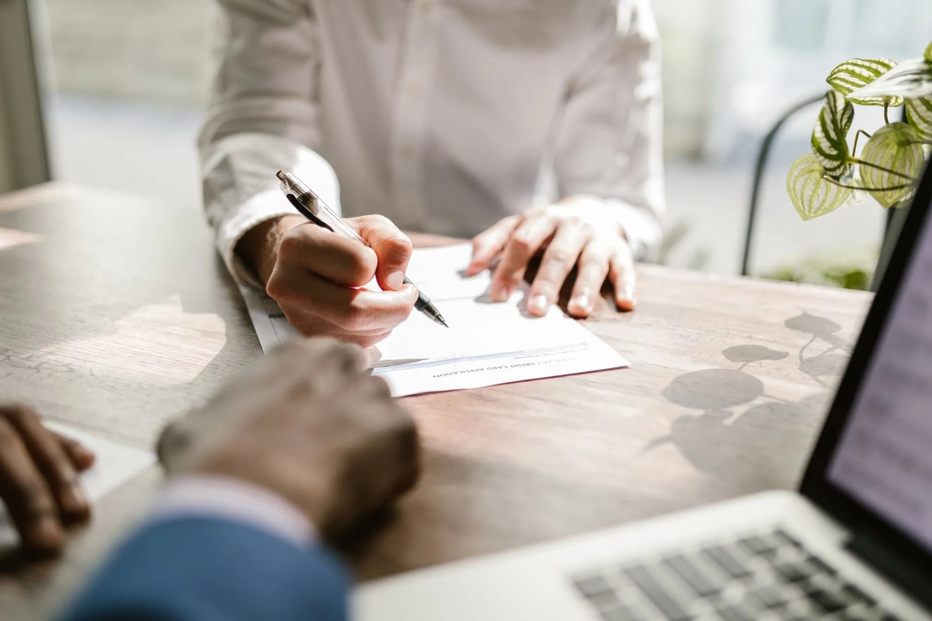 Signing property documents at a desk
