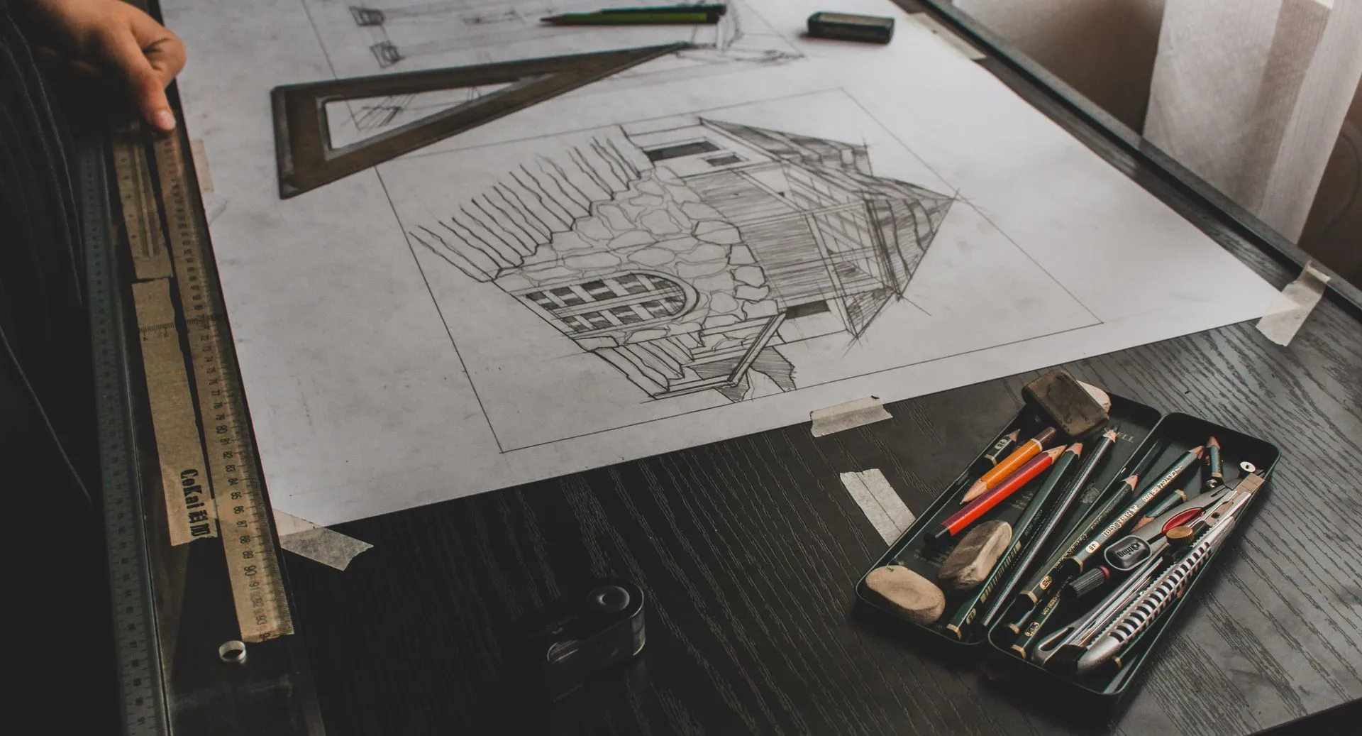 Building design sketch on a desk
